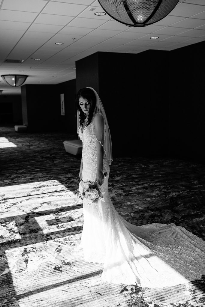 Kansas city wedding at Stoney Creek Hotel, dramatic window light on bride