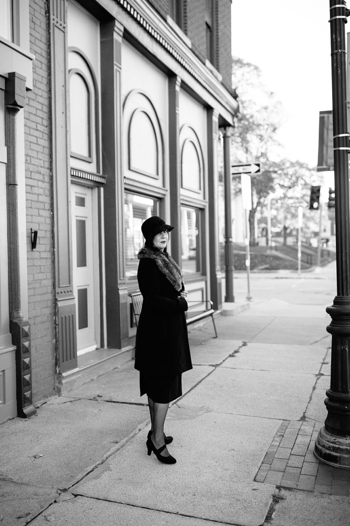 Retro 1920's inspired photoshoot in Lexington Missouri by Kansas City Photographer Natalie Nichole Photography. Women wearing fur coat and black cloche hat