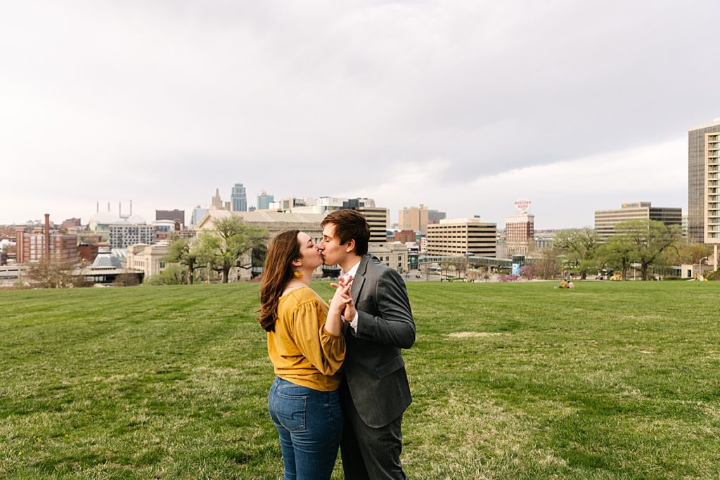 where to propose, best places to propose in kansas city, when to propose, kansas city photographer, liberty memorial, engagement ring, emerald cut engagement ring, kansas city skyline