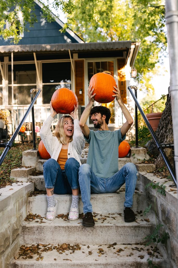 Five Tips For Your In-Home Photoshoot, Kansas City photographer, engagement session, engagement session locations, thrifted home decor, boho home, little blue house, fall engagement session, unique engagement session, intimate engagement session, true love, candid photos, looks like film, pumpkins, halloween decor, golden hour, front porch, silly