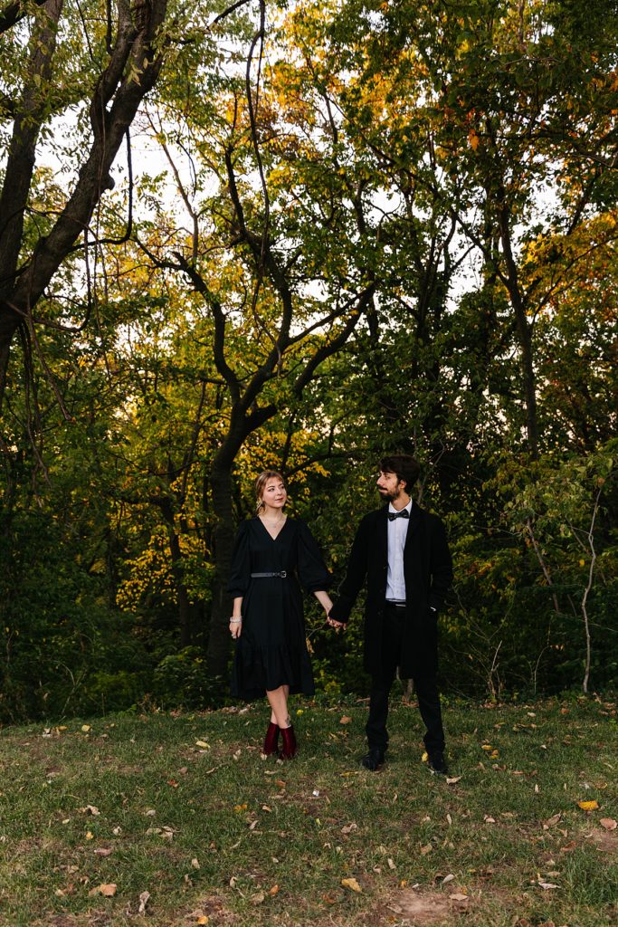Kansas city photographer, tiffany castle, halloween inspired engagement session, spooky engagement session, alternative engagement session, anti-bride, punk, real couple, castle engagement session, abandon building, abandon castle, october, fall photoshoot, black dress, girl with tattoos, looks like film, film engagement photos, golden hour