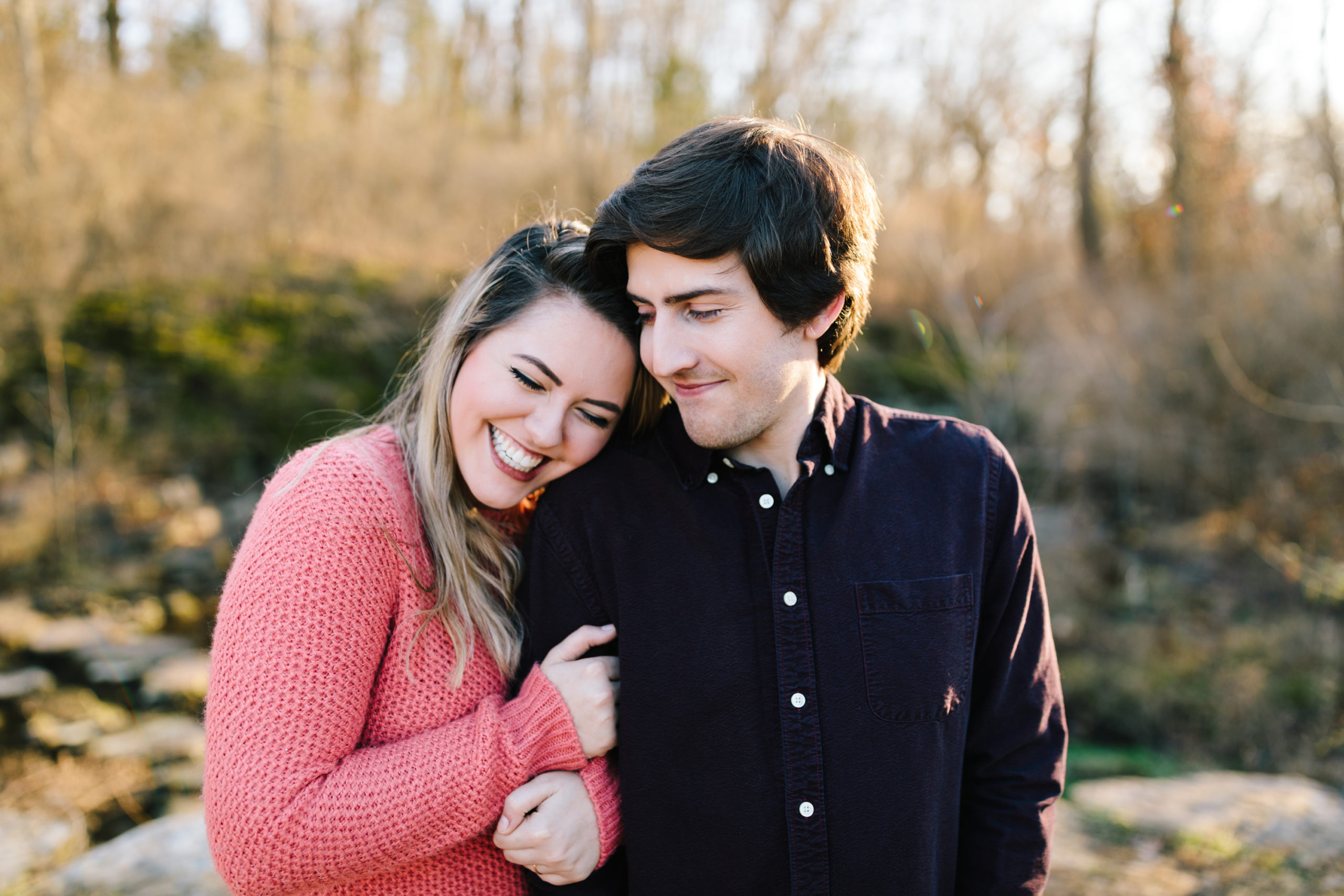couple cuddling during engagement session photographed by Natalie Nichole Photography in kansas city