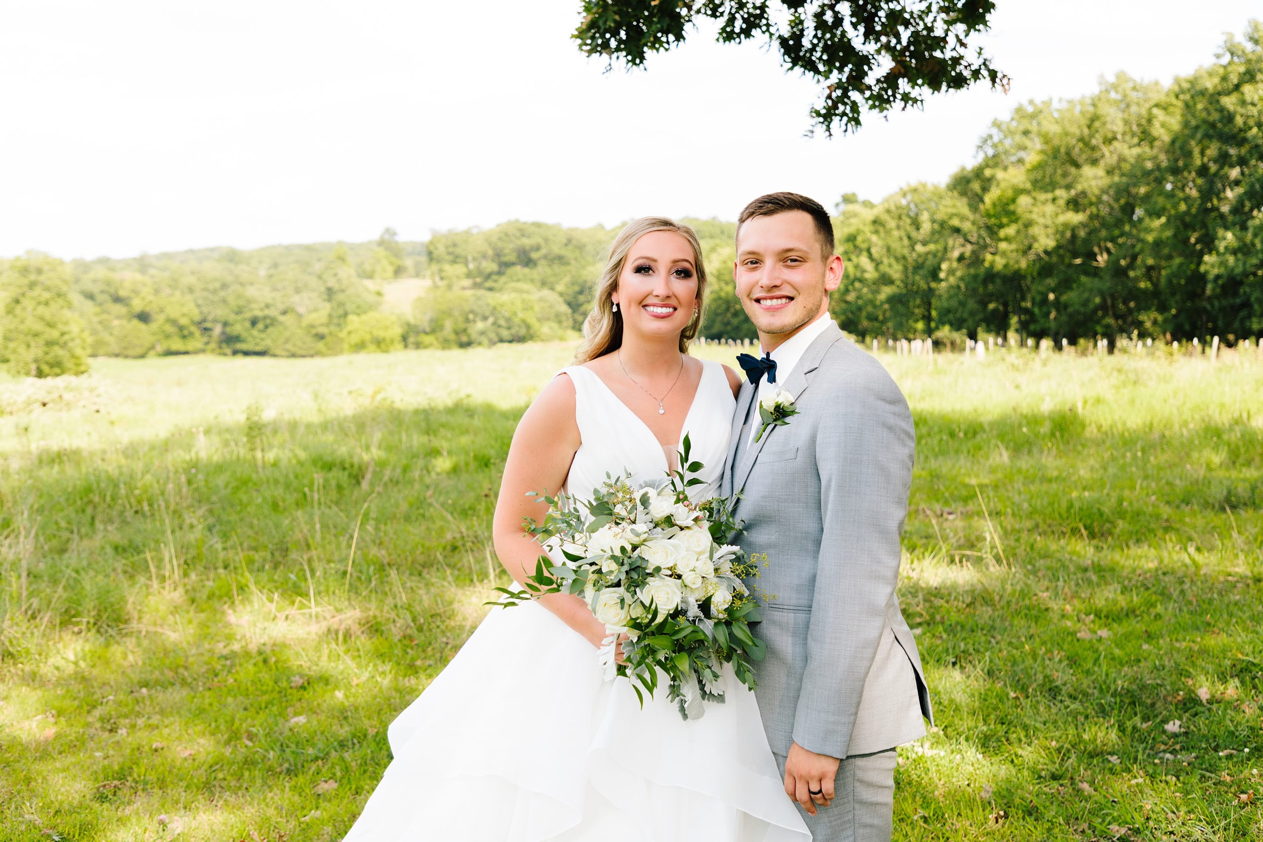 bride and groom at weathered wisdom barn