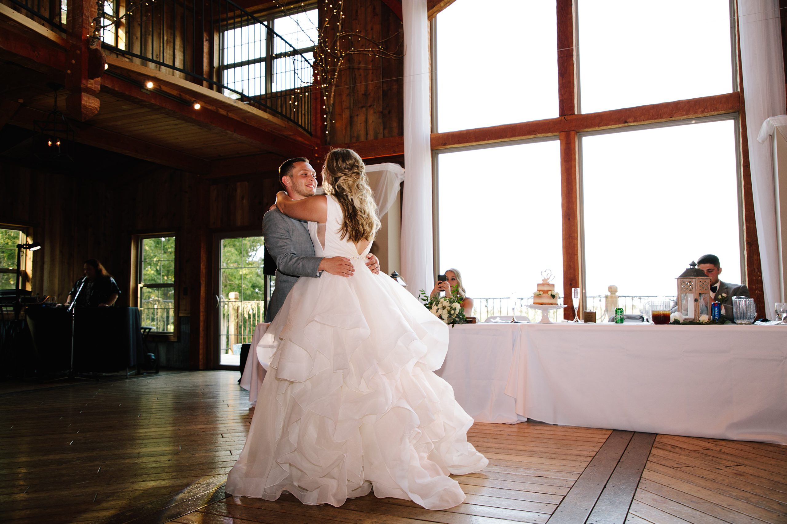 bride and grooms first dance at weathered wisdom barn