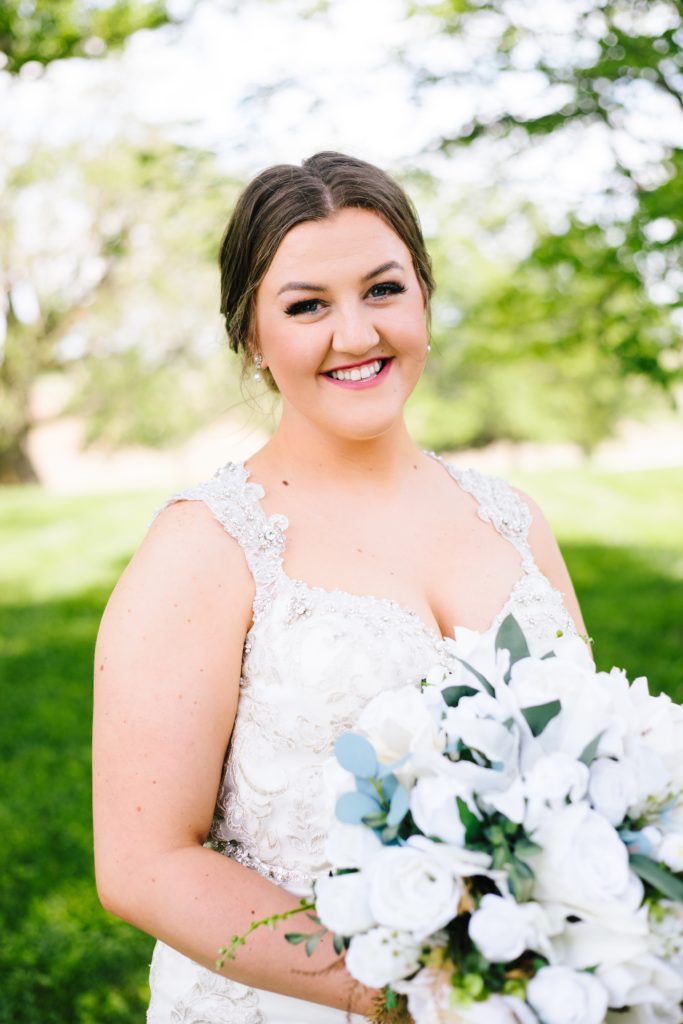 beautiful bride with white lily bouquet