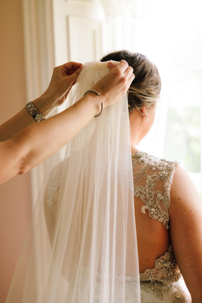 the final touch | lace trim veil in bride's twisted up hair style