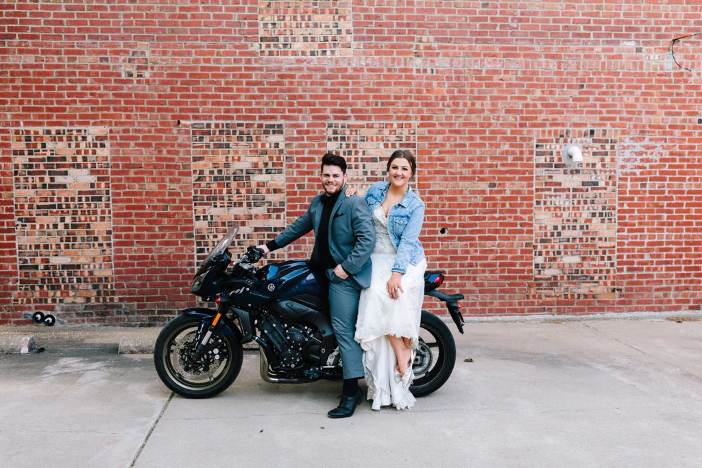 Bride and groom on motorcycle in Kansas City