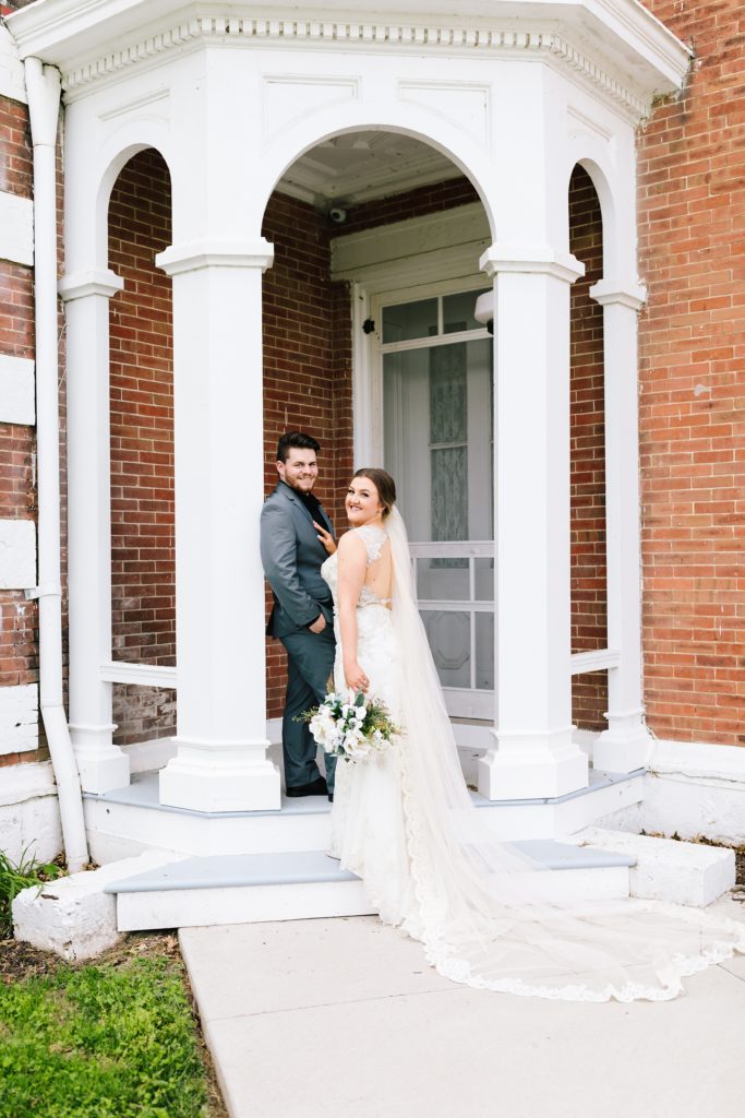 Groom wearing grey suit, bride wearing Jade by Maggie Sottero at Linwood Lawn Bed and Breakfast