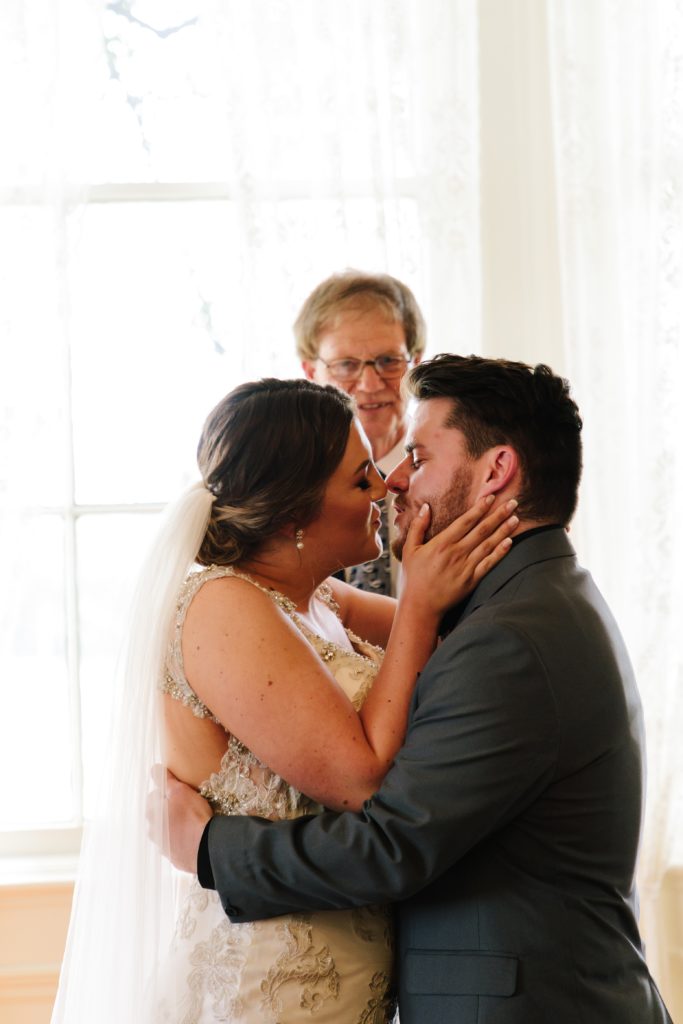 bride and grooms first kiss | Kansas City photographer