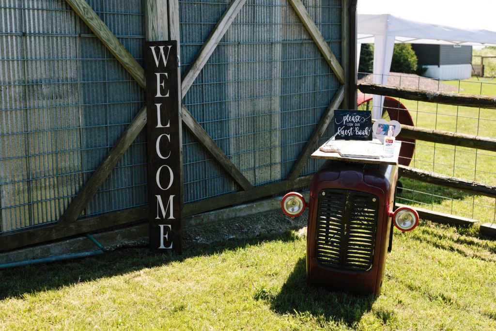 The Barn at Cricket Creek wedding venue, welcome sign, rustic decor