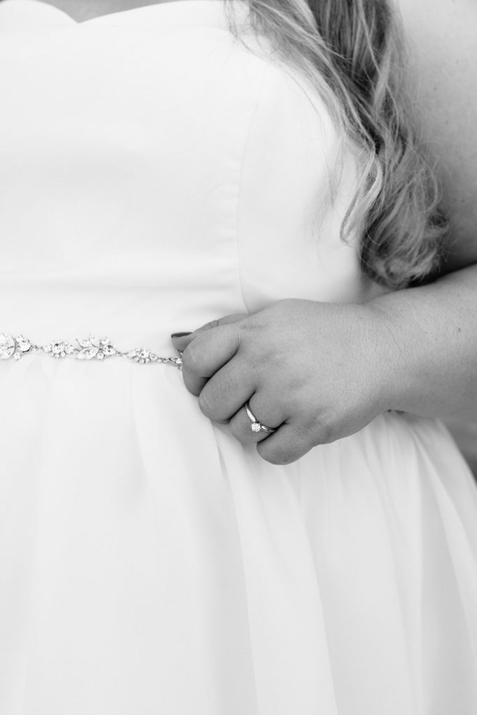 bridal details, delicate belt, solitaire engagement ring, minimal style,