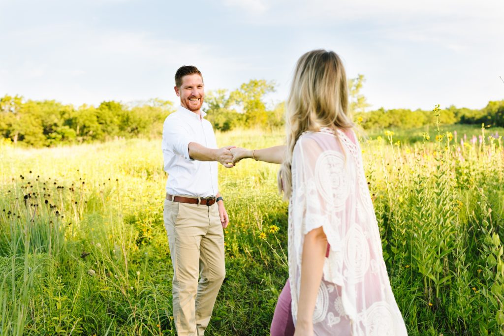sunrise maternity session at Shawnee Mission Park, Kansas City Photographer, baby announcement, gender reveal, couple dancing in field of wild flowers