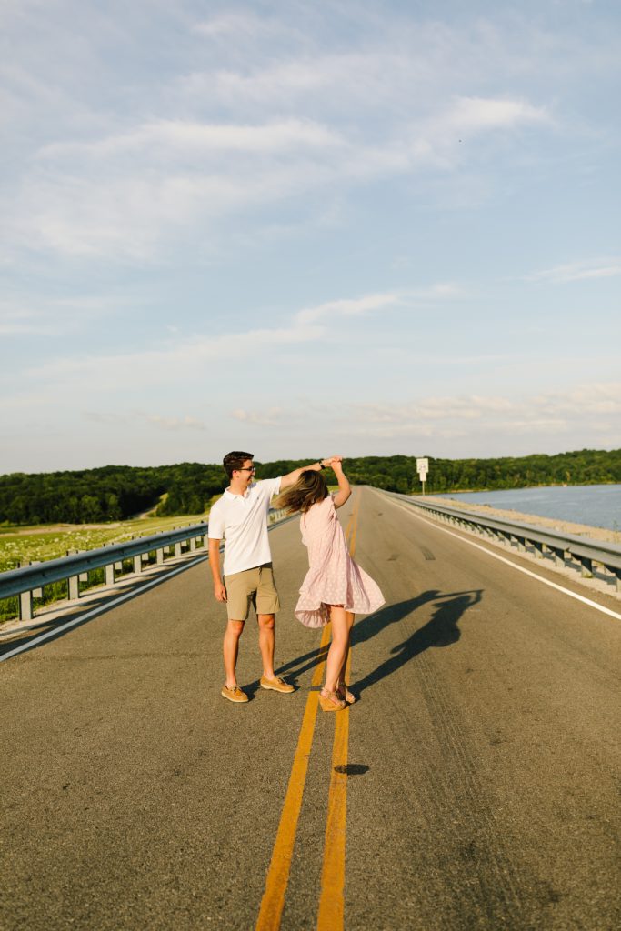 sunset photos, couples session, couples photos, blue springs lake, kanas city photographer, Natalie Nichole Photography, summer photos, adventure awaits, spin, dancing in the street, golden hour, engagement session, wedding inspo, engagement session inspiration