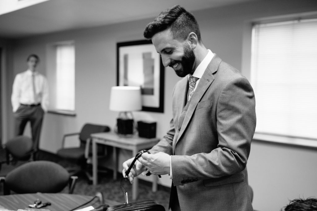 groom gift, groom opening watch before his Wedding at Gashland Evangelical Presbyterian Church in Kansas City