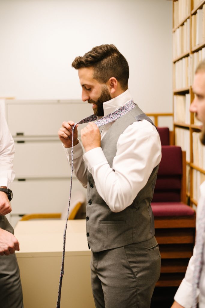 groom getting ready for Wedding at Gashland Evangelical Presbyterian Church in Kansas City, floral tie, grooms attire