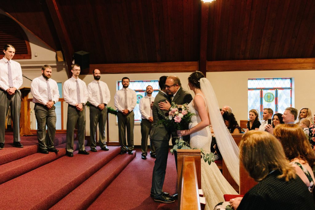 father giving away the bride, church wedding, religious wedding ceremony,