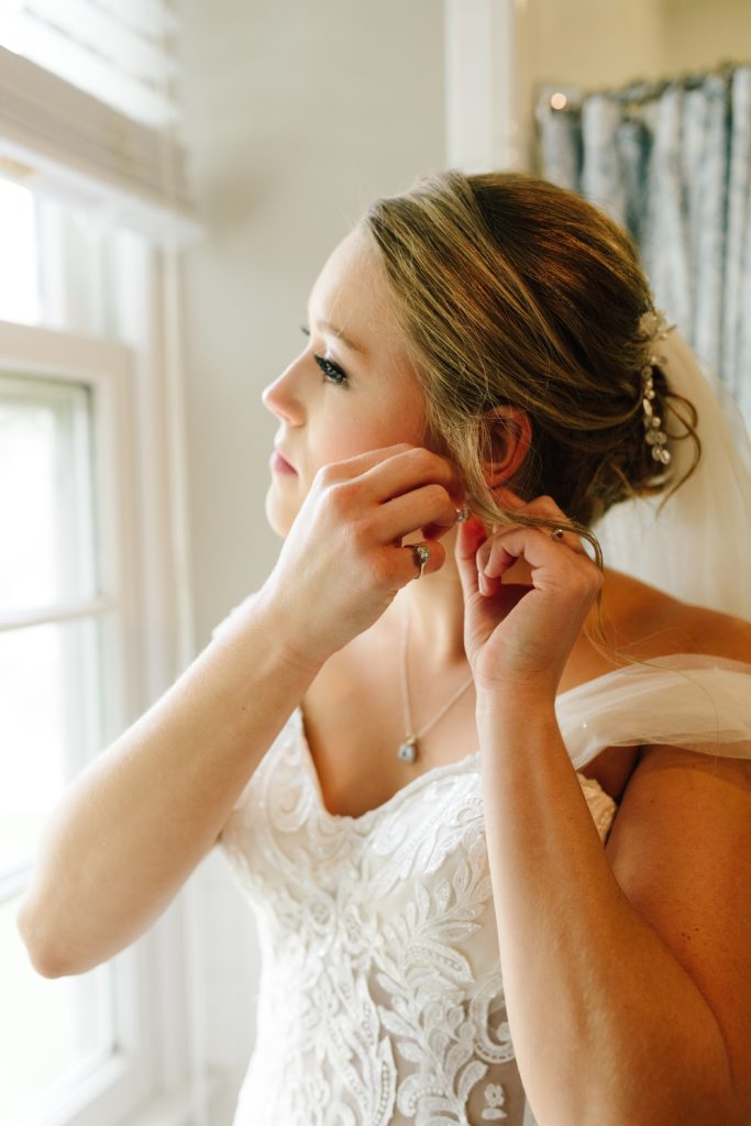 Summer Wedding at Mildale Farm, Natalie Nichole Photography, Kansas City Wedding Photographer, bride putting on earrings, bride getting ready