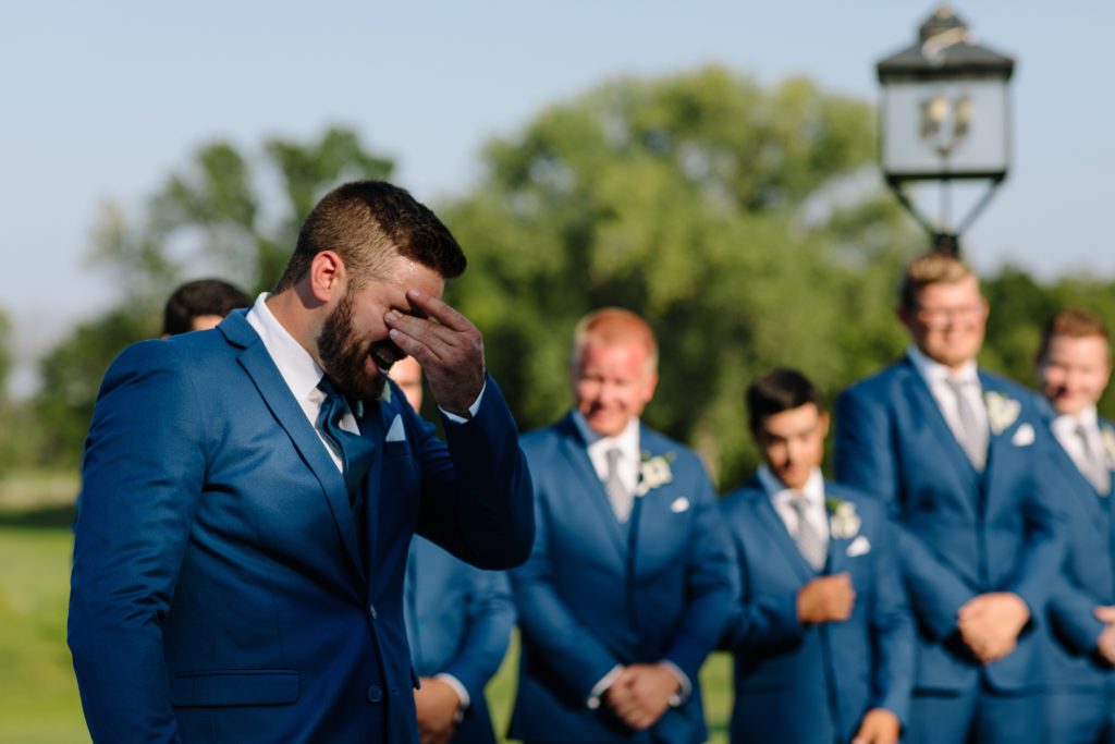 Summer Wedding at Mildale Farm, Natalie Nichole Photography, Kansas City Wedding Photographer, blue and white wedding, anemone, navy, summer wedding color palette, shades of blue, boutonniere, blue suits, generation tux, grooms reaction, groom crying, real moments, allyouwitness, authentic love, outdoor wedding, wedding ceremony outside