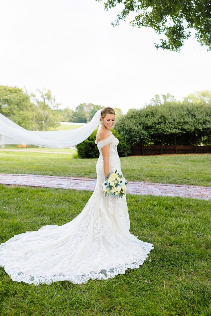 Brides Share Their Wedding Advice, wedding planning, how to plan your wedding, what brides say, wedding planning tips, kansas city wedding, wedding planning advice, cathedral veil, bridal portraits, wedding dress with train, lace wedding dress, blue and white bouquet, blue and white color palette, emily hart bridal, mildale farm ,