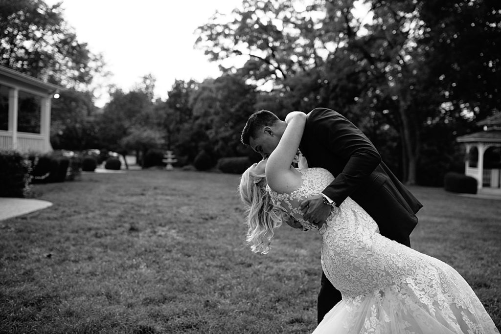 Summer wedding at the Hawthorne house, Kansas city wedding venue, Kansas city photographer, wedding inspo, wedding planning, wedding portraits, wedding pictures, sunset, golden hour, husband and wife, newlyweds, newly married, wedding ceremony, navy suit, lace wedding dress, maroon bow tie, black and white wedding photos, looks like film
