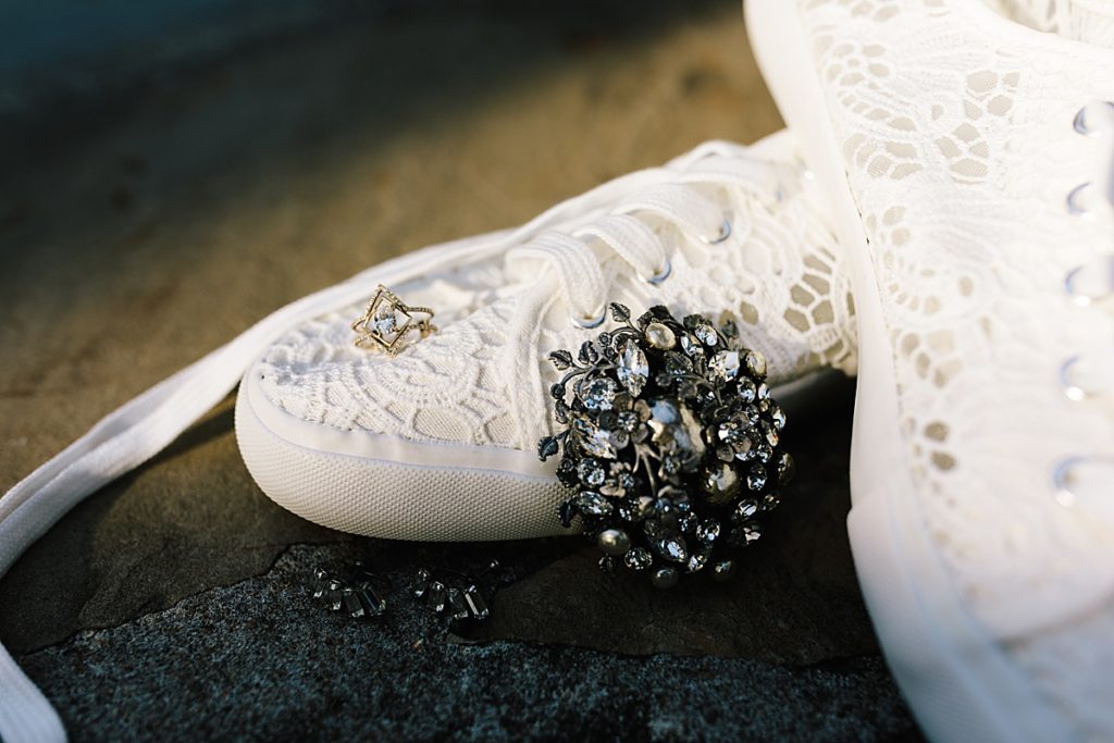 bride wears a brooch passed down to her from her grandma