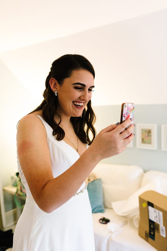 bride facetimes with grandparents before her intimate wedding ceremony