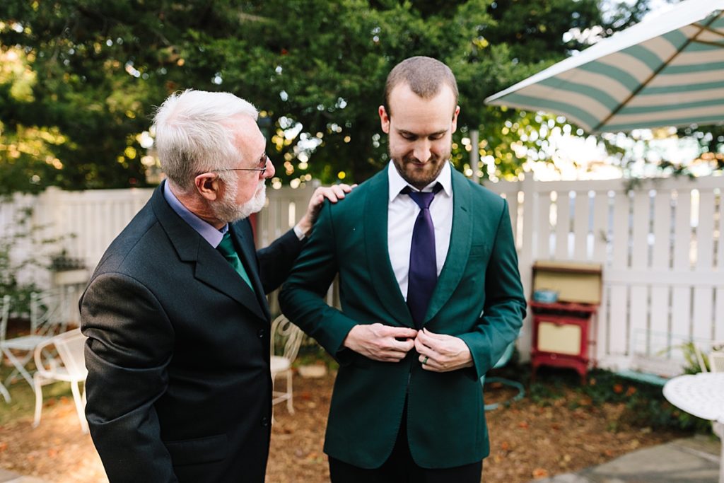 father of the groom helping him get ready before his micro wedding in Kansas City
