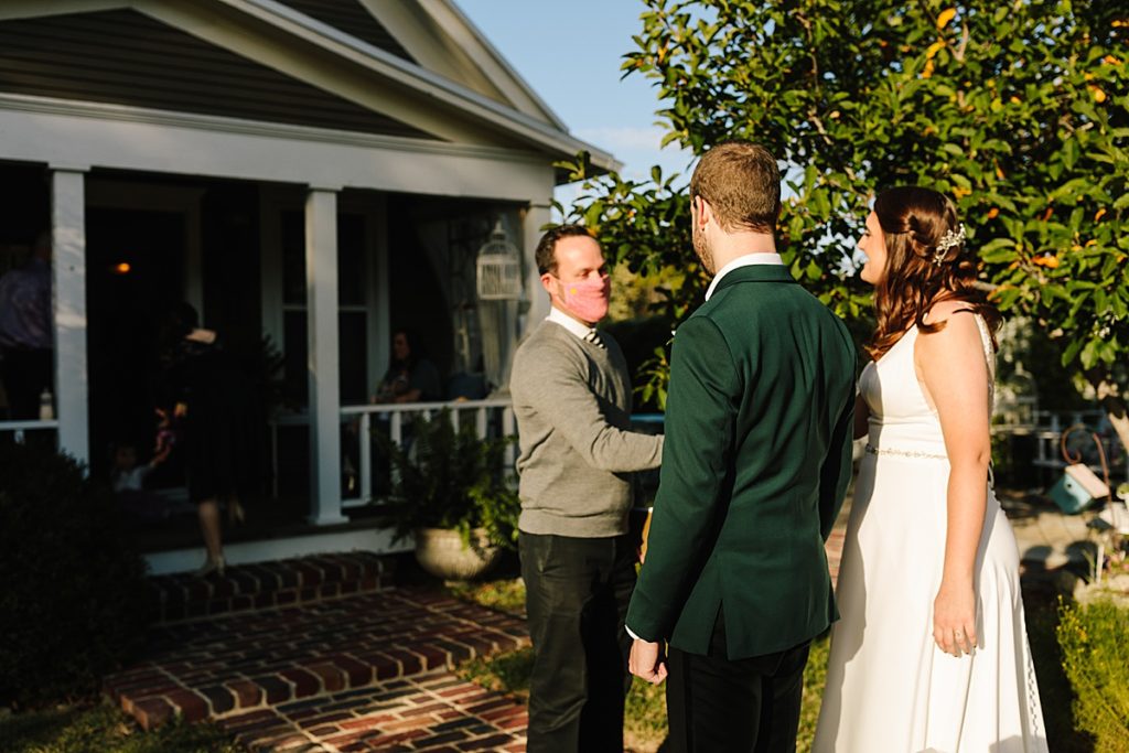 bride and groom greet their officiant at their intimate wedding in kansas city