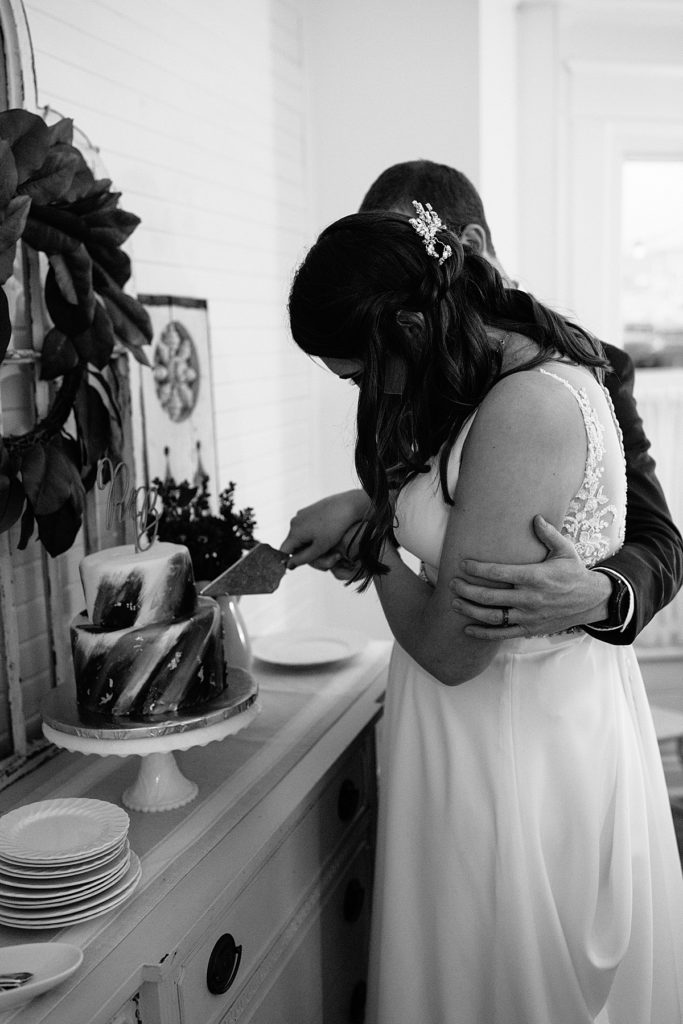 bride and groom cutting their gluten free wedding cake