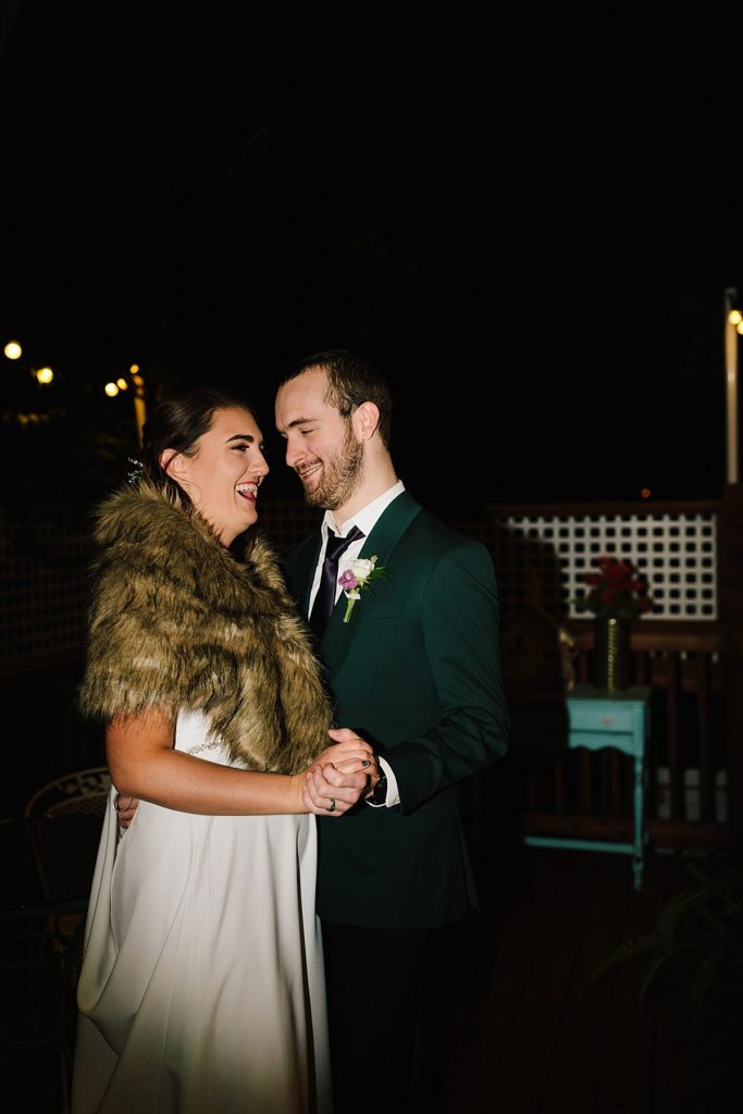 bride and grooms first dance outside at night