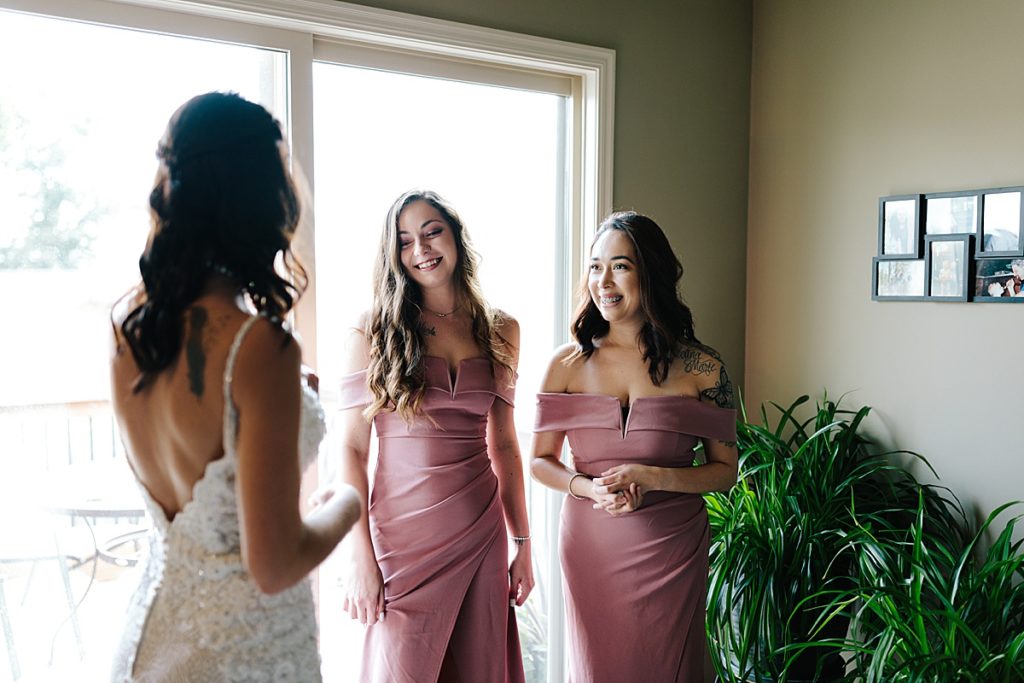 bridesmaids wearing mauve off the shoulder dresses from windsor