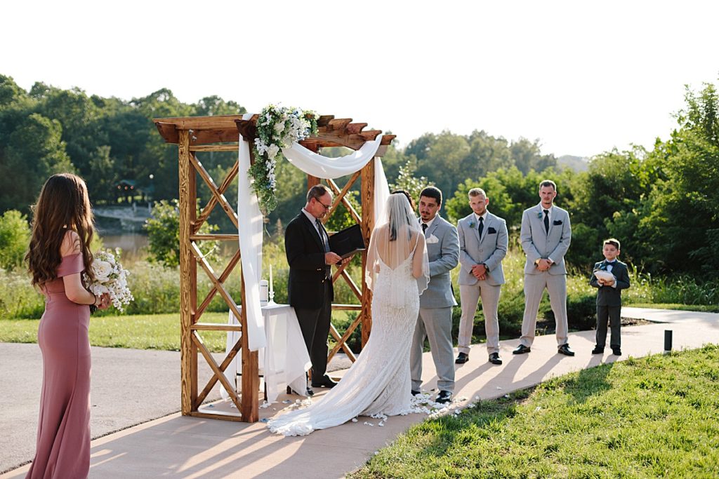 bride and groom sharing their vows during their intimate outdoor wedding ceremony