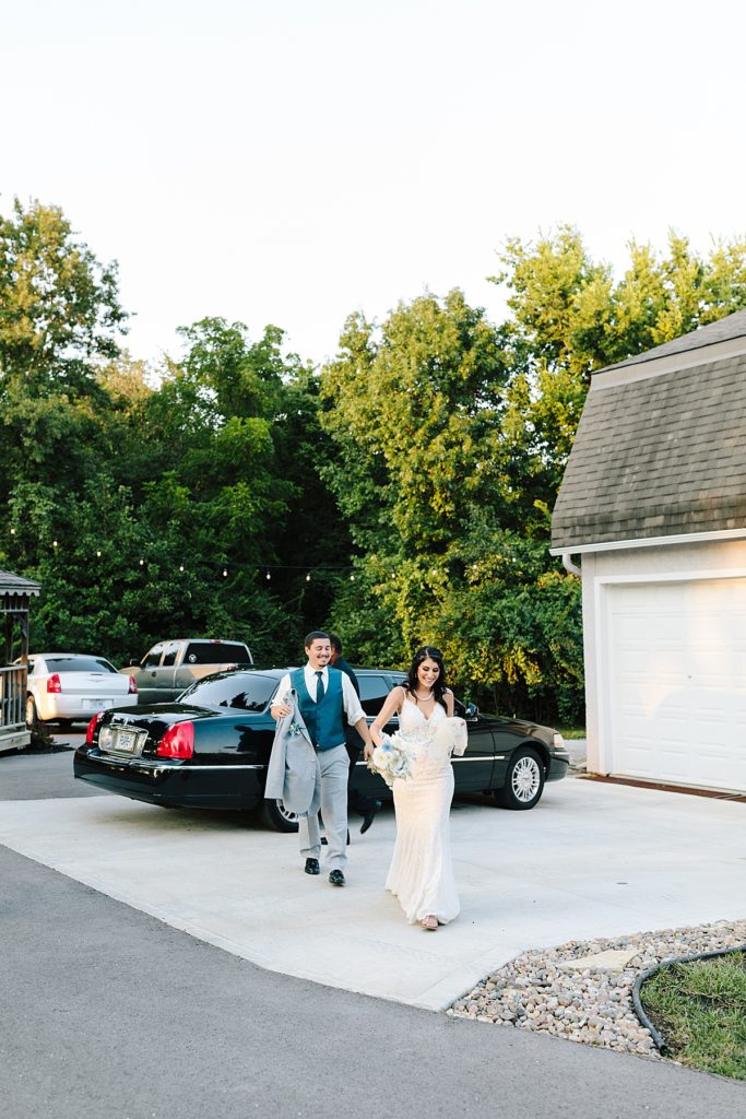 bride and groom arrive at their backyard wedding reception