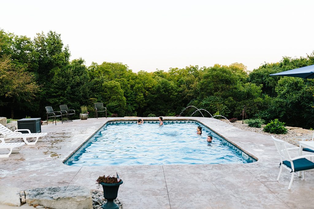 backyard wedding reception with pool during the summer