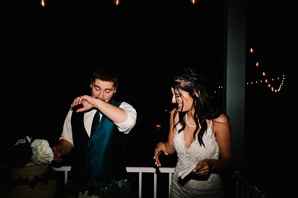 bride and groom celebrating at their backyard wedding reception