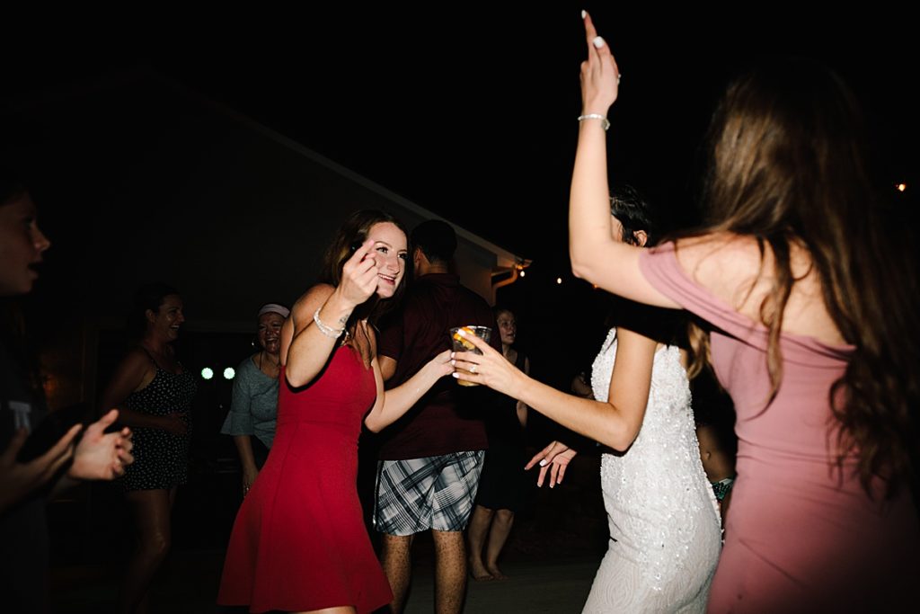 wedding guest dance and celebrate at backyard wedding reception