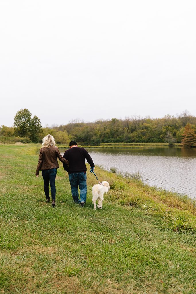 couple walking their dog at James A Reed Memorial Wildlife Area in Kansas City