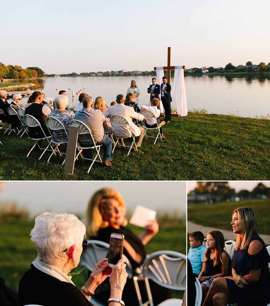 wedding guests films fall wedding ceremony on cell photo during golden hour at Raintree Lake