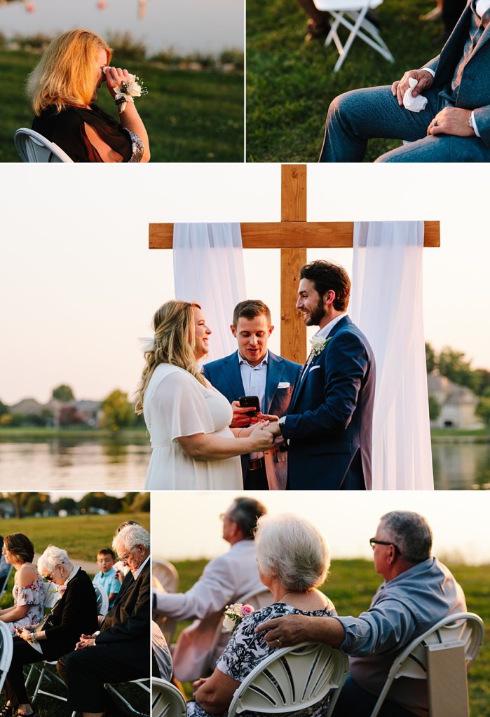 guests cry at intimate wedding ceremony while bride and groom read their vows at their fall elopement at Raintree Lake in Kansas City