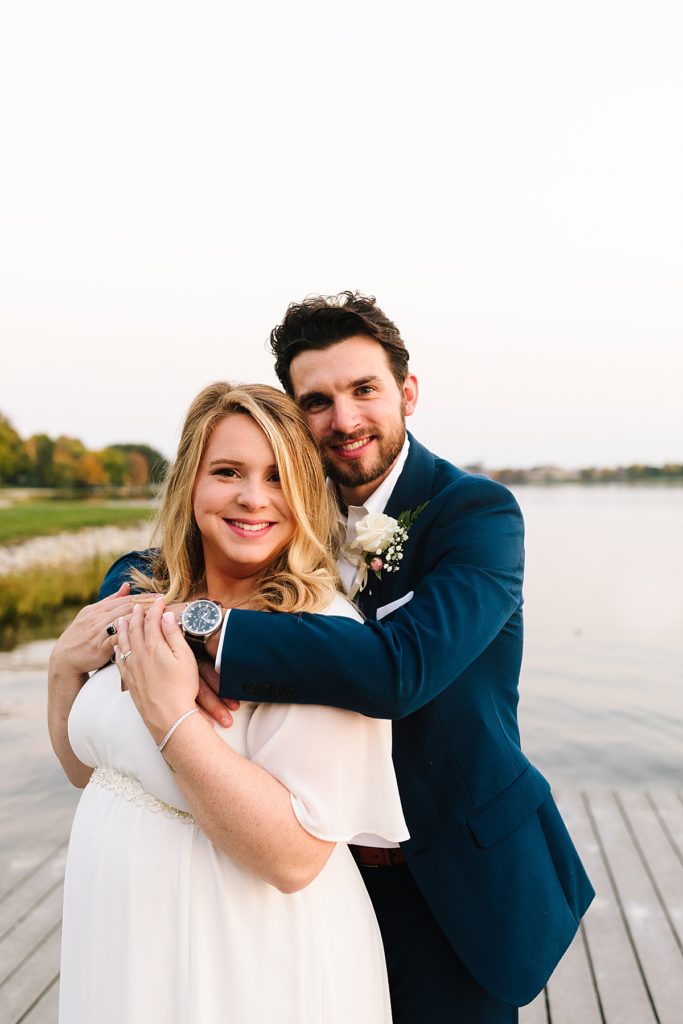 bride and groom change their large wedding to an intimate elopement at the raintree lake in kansas city