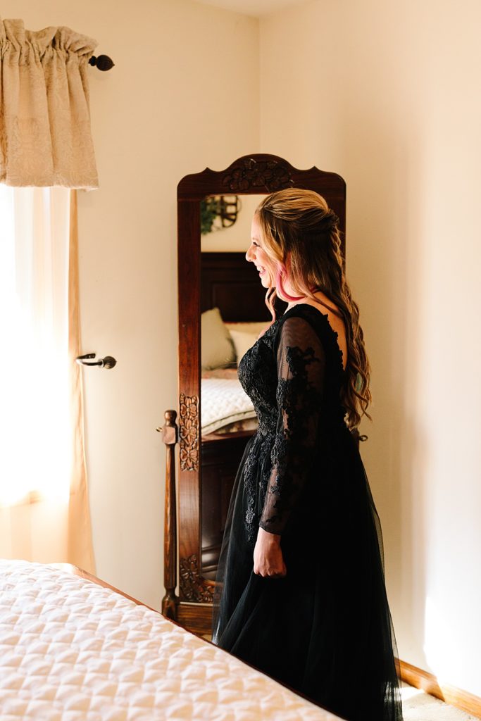 bride wears a black lace wedding dress from amazon for her halloween wedding