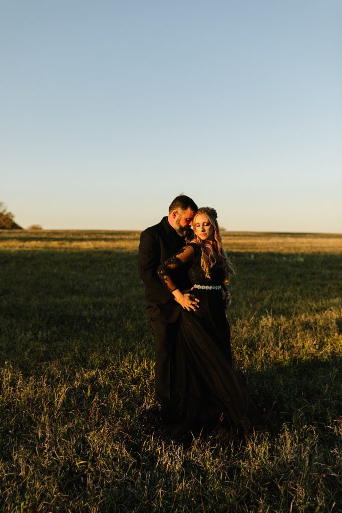 golden hour husband and wife portraits after halloween wedding ceremony