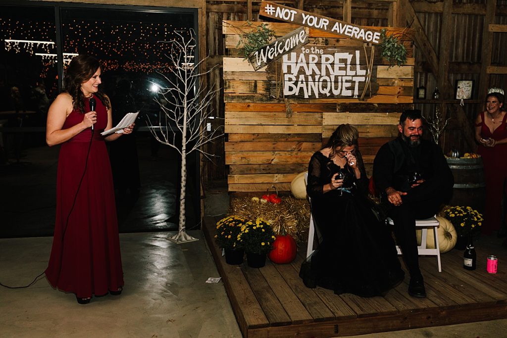 bridesmaid gives speech at halloween wedding in lawrence kansas at barn wedding venue, how to write your maid of honor speech