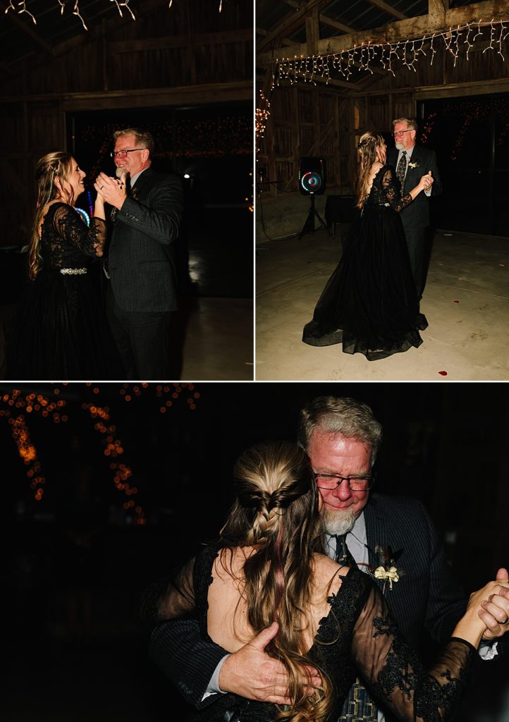 bride and her dad dance at her halloween wedding reception in a barn in lawrence kansas