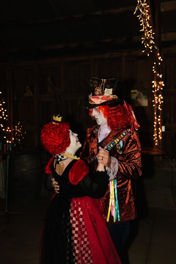 halloween wedding in lawrence kansas with costume contest during wedding reception, mad hatter costume, queen of hearts costume, couples costume ideas
