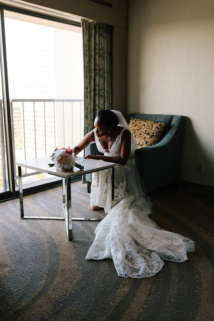 Choosing Your Getting Ready Space: Tips From a KC Wedding Photographer, the westin hotel, crown center, elopement, bride writing her vows, writing a love letter to her future husband
