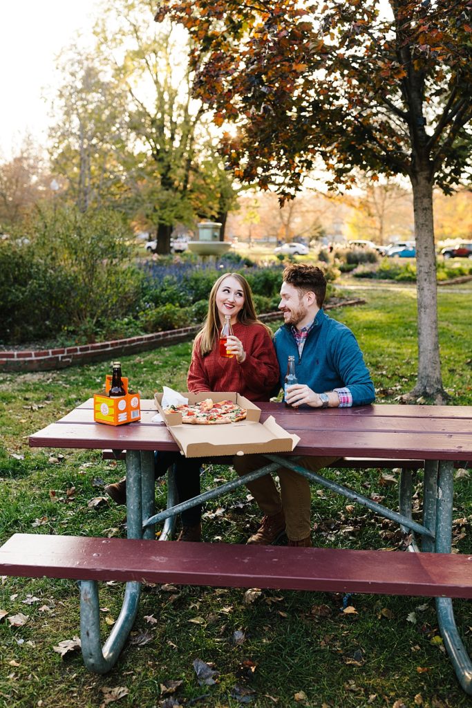 fall date ideas, pizza in the park, pizza picnic, pizza photoshoot, engagement session ideas, what to do at your engagement photos, chill couple, unique couple, adventurous couple, laid back couples photos, lawrence kansas, rock chalk, mass street, lawrence date ideas