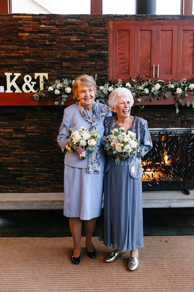 kansas city wedding photographer, bride with her mom, navy mother of the bride dress, sparkly mother of the bride dress, white florals with greenery, at home wedding, covid wedding, intimate wedding, backyard wedding, simple wedding dress, backyard wedding dress, white lulus dress, blue and white color palette, dusty blue bridesmaids dress, grandmas with the bouquets, grandma flower girls,