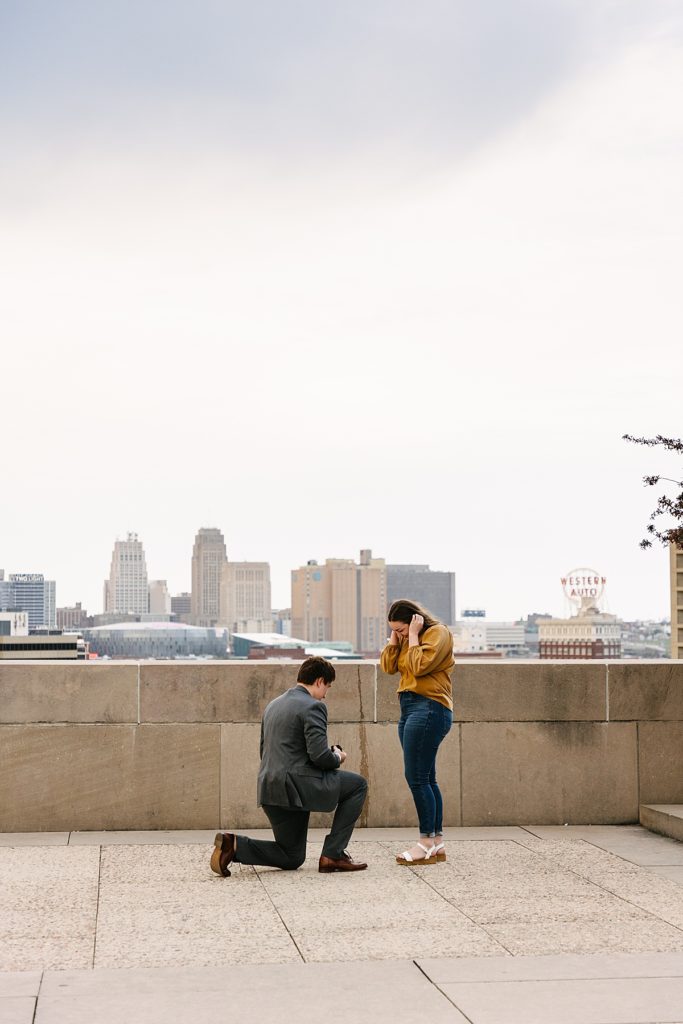 Proposal at the WWI memorial in Kansas City, how to propose, when to propose, proposal photographer in kansas city, kansas city engagement photographer, what to wear when you get engaged, should i propose, engagement ring, kansas city skyline, where to propose in kansas city