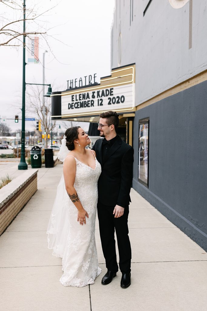 Planning a Winter Wedding in Kansas City, Mission Theater, December wedding, black suit, lace wedding dress, kansas city photographer, marquee letters, marquee wedding sign, theater venue